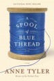 A spool of blue thread. Cover Image